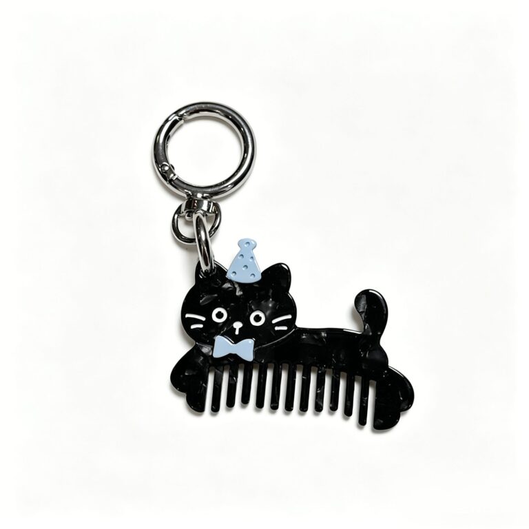 Black cat-shaped comb charm with a blue hat and bow tie