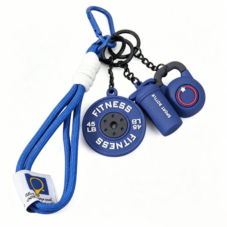 Blue fitness charm set with weight-plate, kettlebell and bottle shapes attached to a blue wrist loop