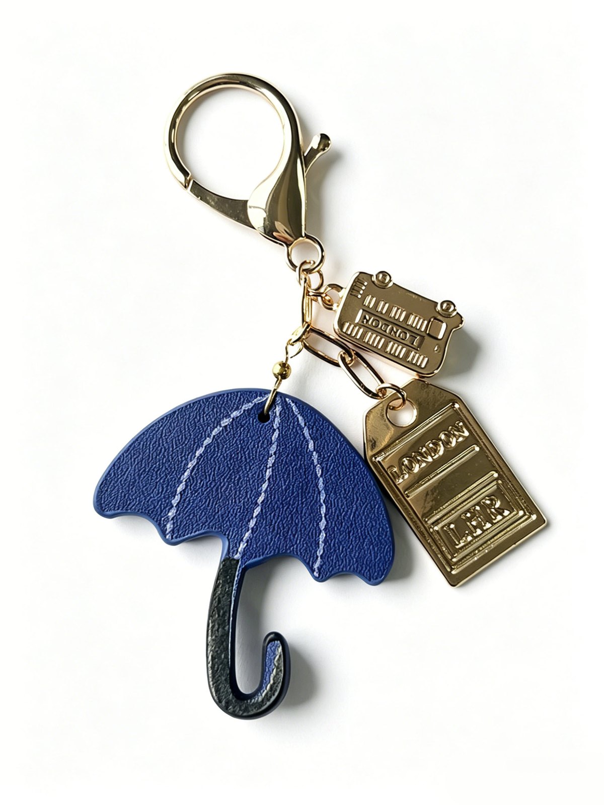 Blue umbrella-shaped keychain with a gold-tone clasp and rectangular tags
