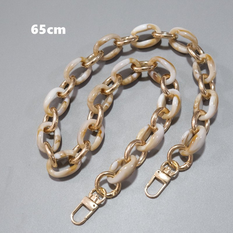 Long cream and brown oval-link strap in curved view