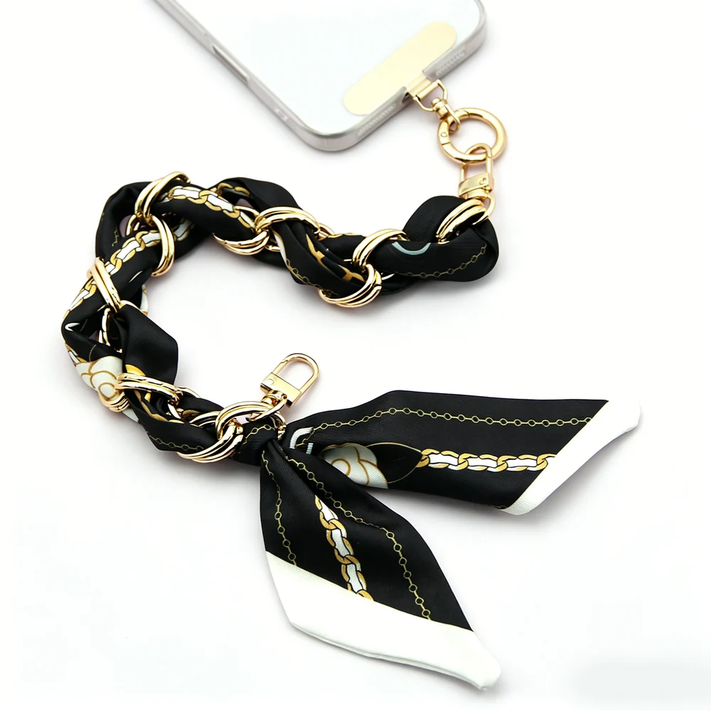 Custom black scarf phone chain with gold hardware for wholesale wristlet phone chain programs.