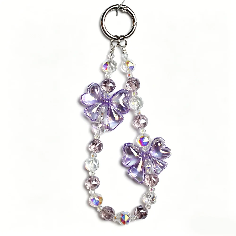 Custom purple flower beaded phone chain with ring attachment for handmade-style phone accessories.