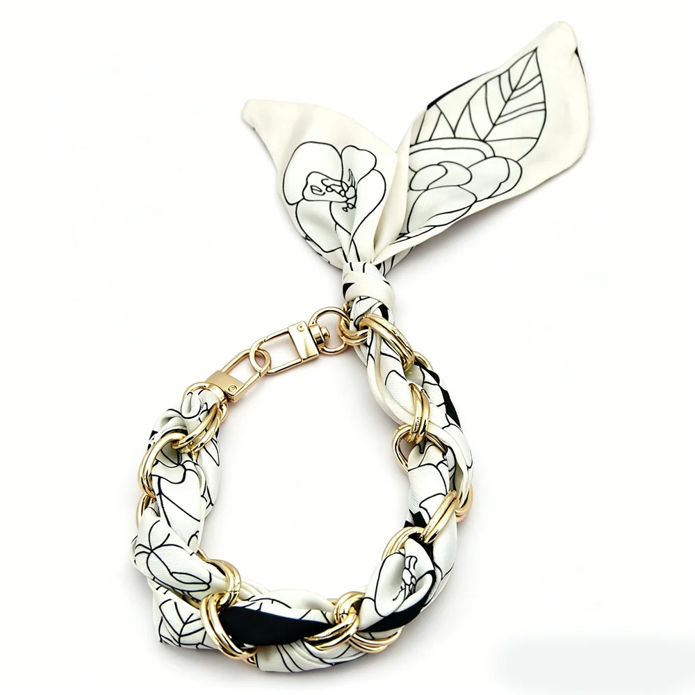 Custom silk scarf wristlet phone chain with gold hardware for premium phone accessory collections.
