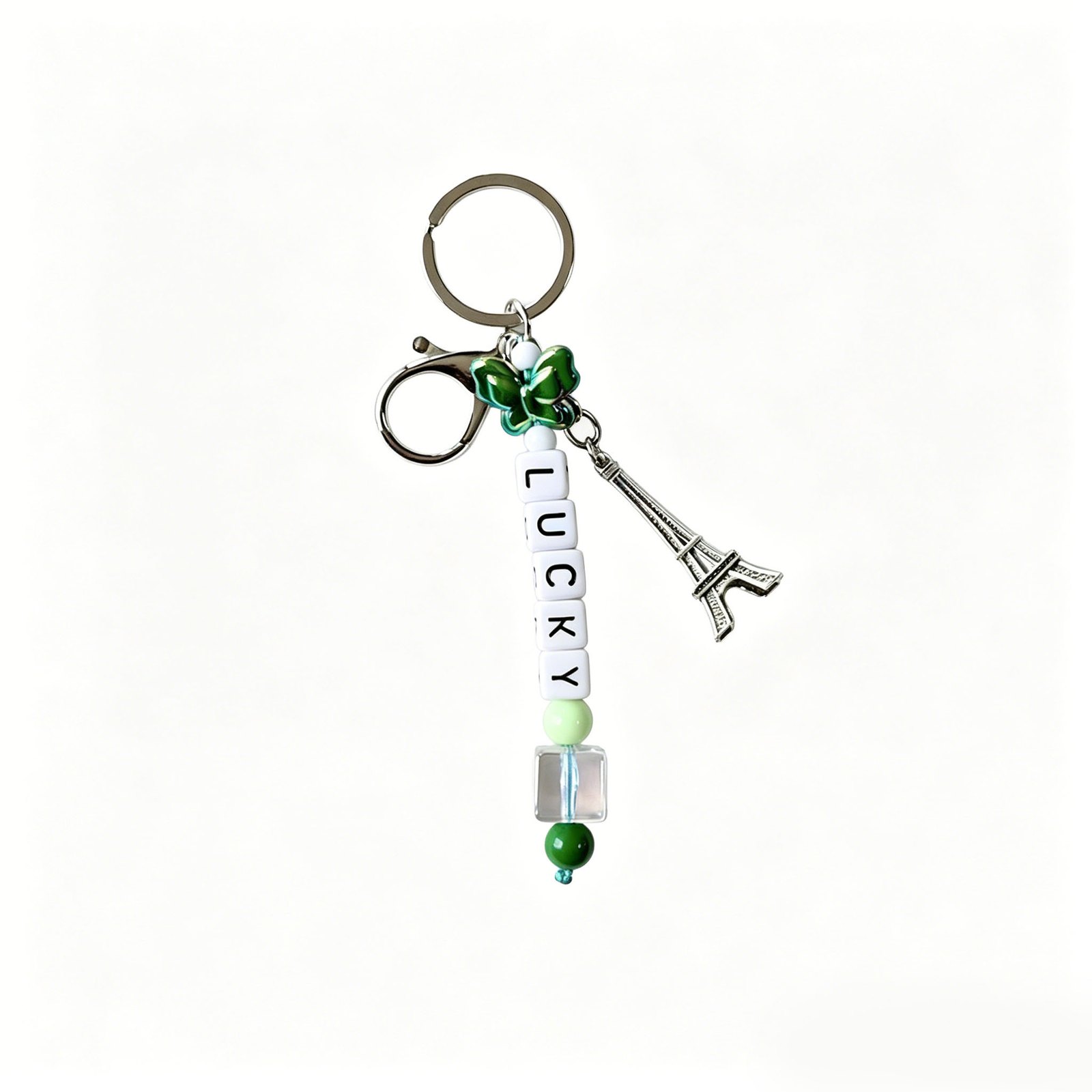 LUCKY bead strand with tower accent and clasp and round ring in green, white, silver-tone, shown as a keychain.
