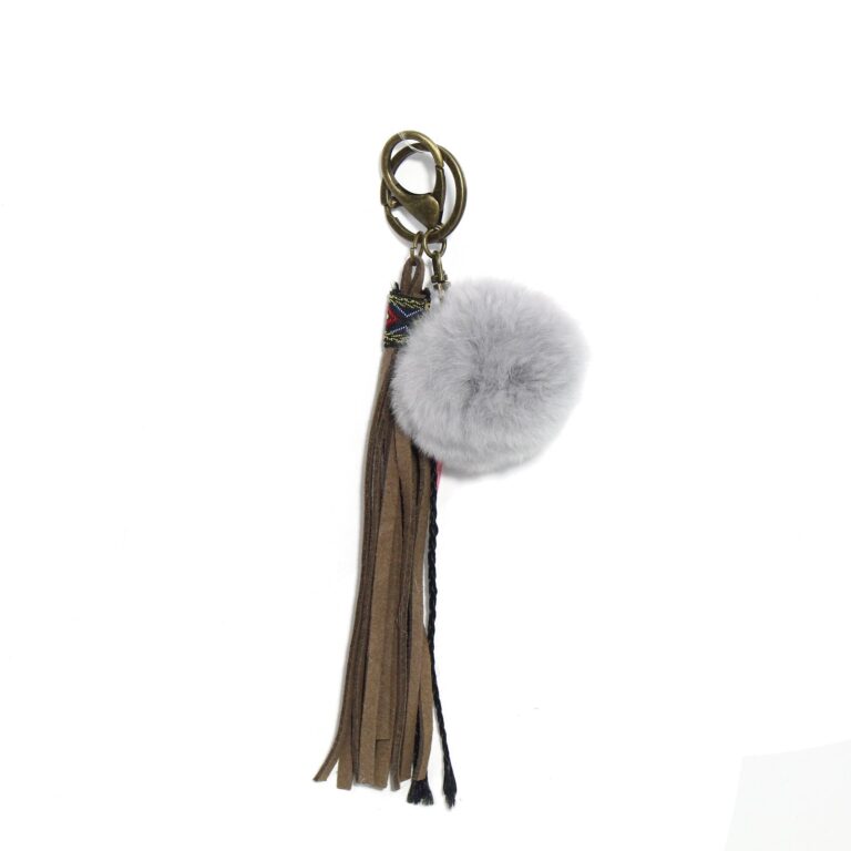 Grey pom-pom and long brown tassel attached to a keychain clasp