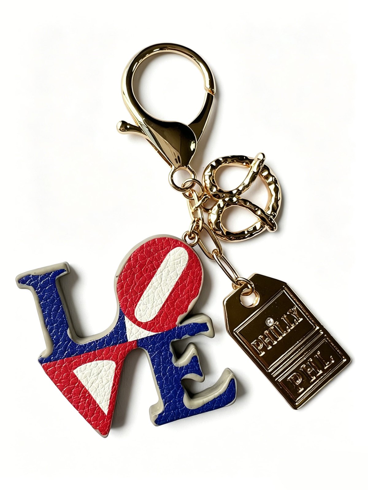 Red, blue and cream LOVE letter charms attached to a gold-tone keyring and clasp
