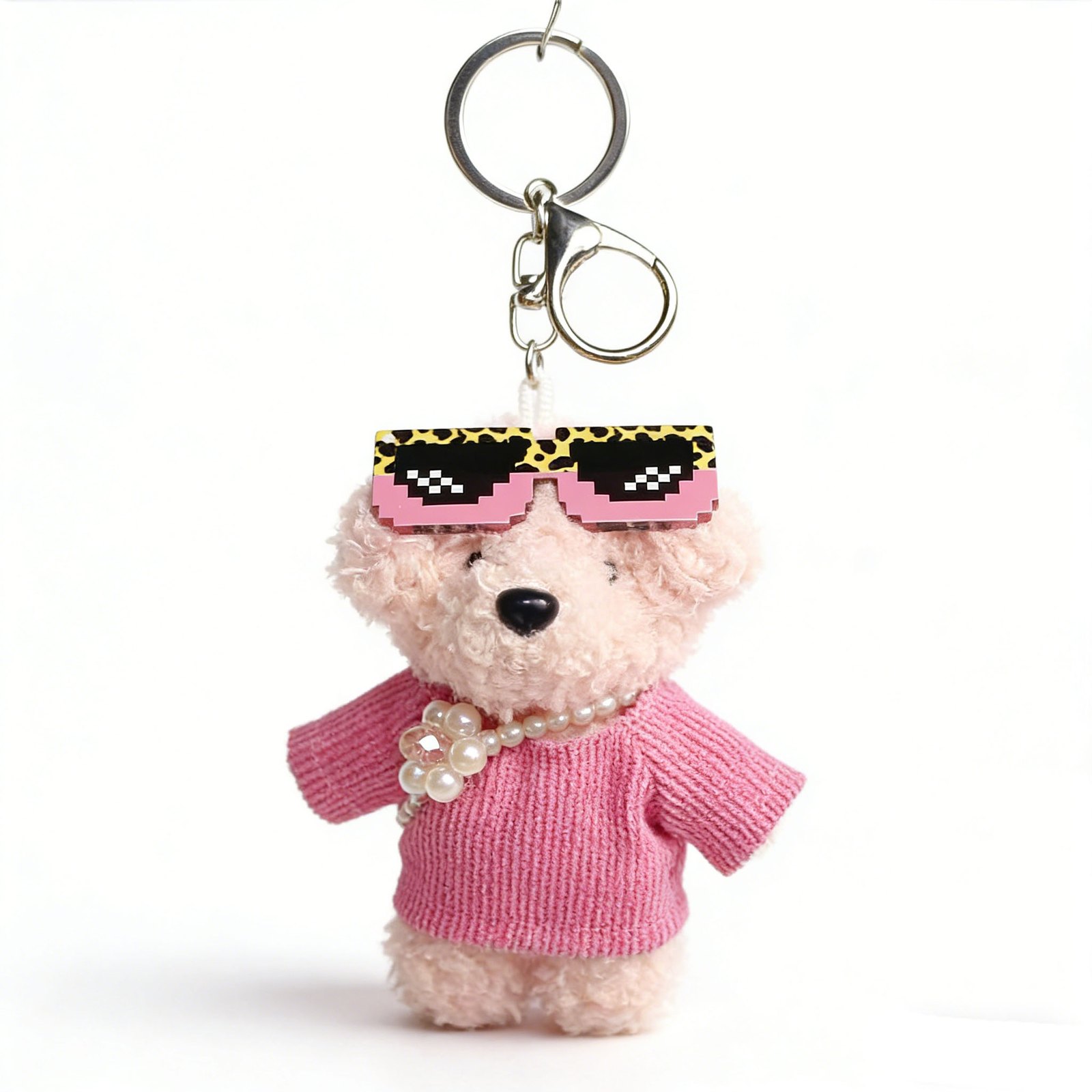Pink plush bear keychain wearing sunglasses, a pink top and pearl-like beads