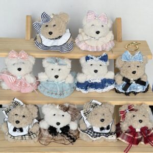 Ten dressed fuzzy animal charms with bows on display