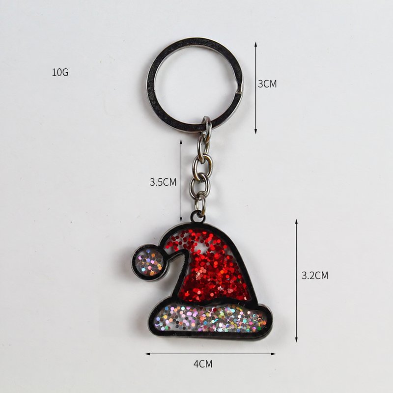 Red glitter hat-shaped keychain with a black split ring and size measurements