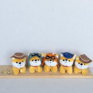 Five yellow dressed fuzzy animal charms