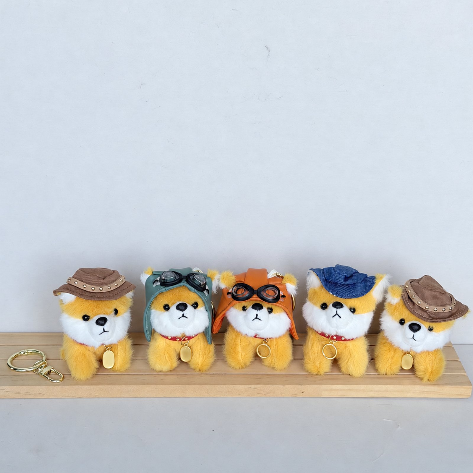 Five yellow dressed fuzzy animal charms