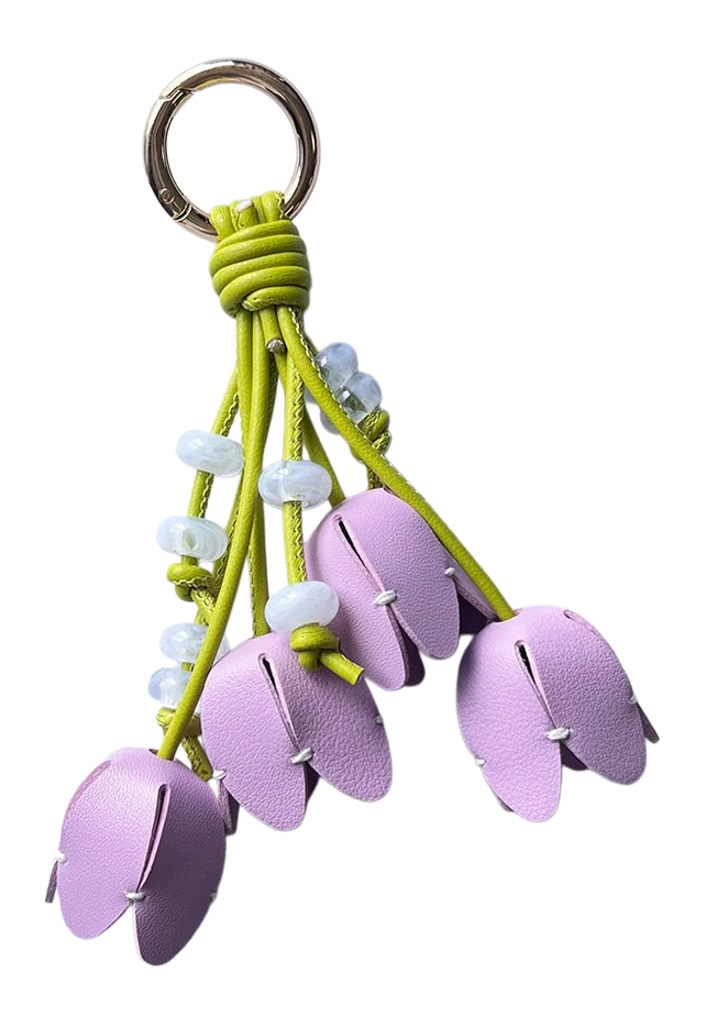 Custom purple flower bag charm with keyring for wholesale accessory brand programs.