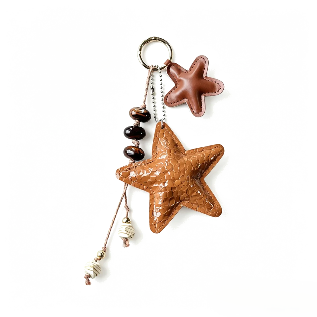 Custom caramel star tumbler charm with rope and beads for drinkware accessory buyers.
