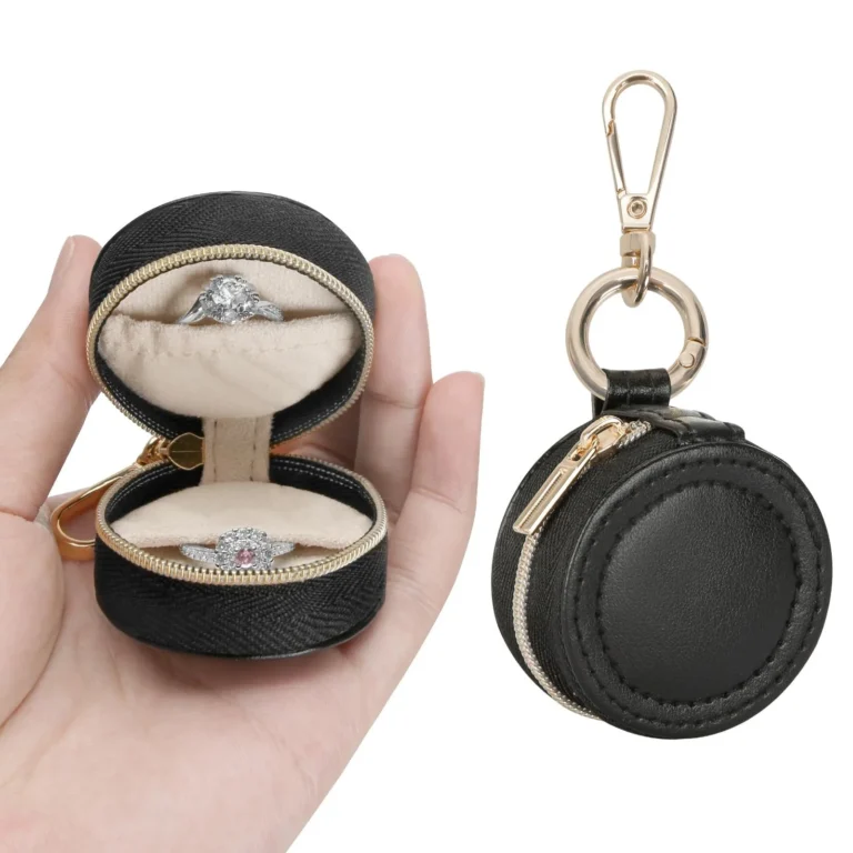 Black round jewelry case in open and closed views