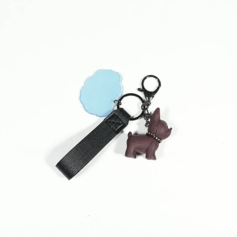 Brown dog-figure keyring with blue flower tag