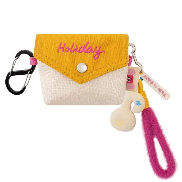 Cream-and-yellow flap pouch with character and loop charms