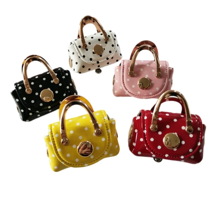 Five dotted mini handbag pouches with clear-looking handles