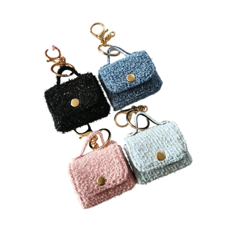 Four fuzzy mini handbag charms