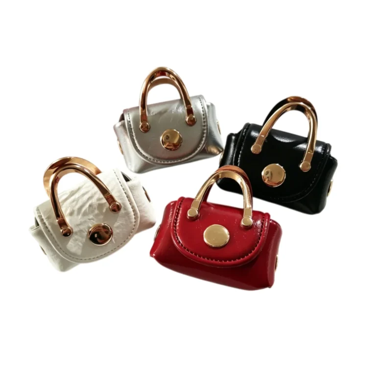 Four mini handbag pouches with clear-looking handles