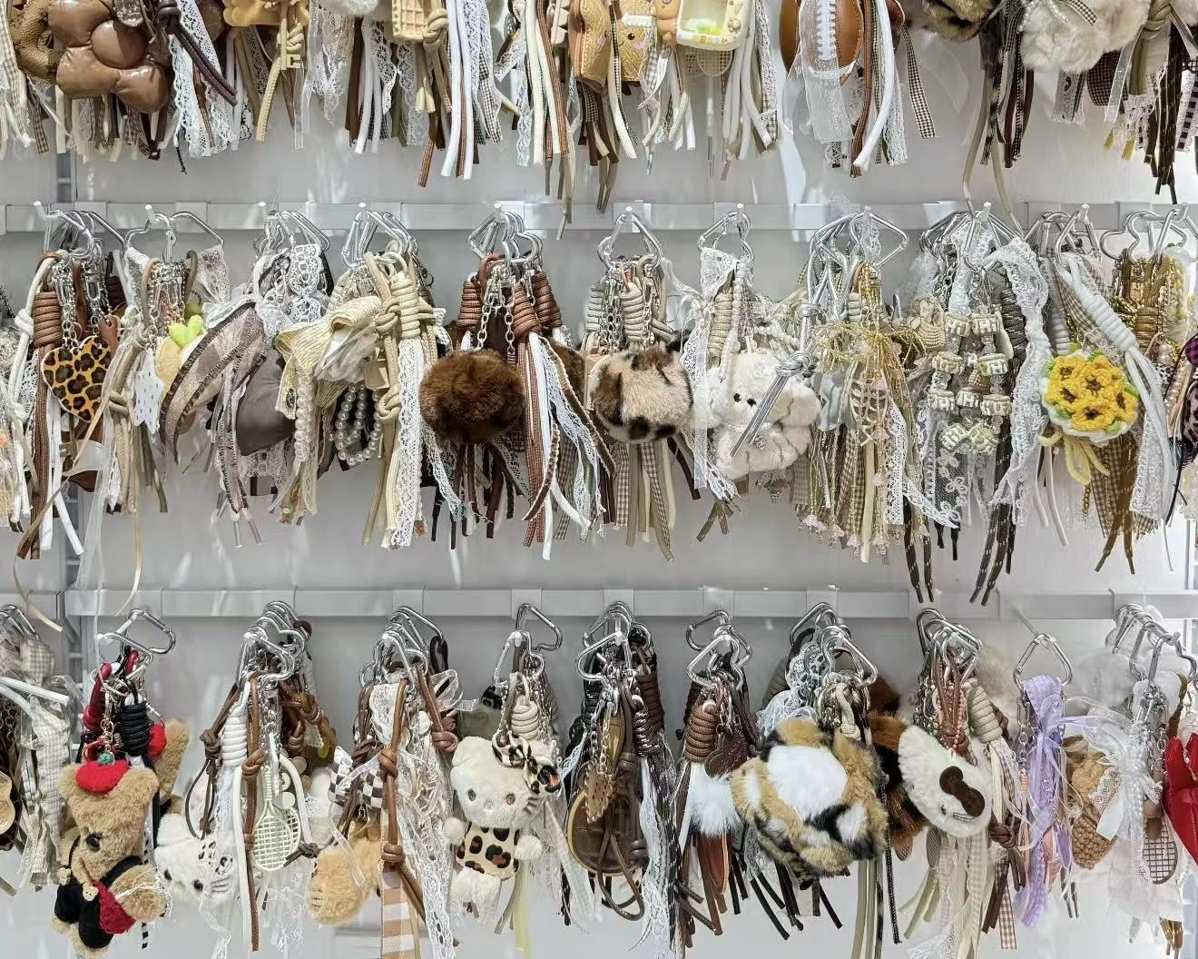 Bag charm retail display with hanging products for gift shops and boutiques