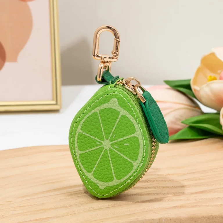 Green citrus-slice coin purse in tabletop display