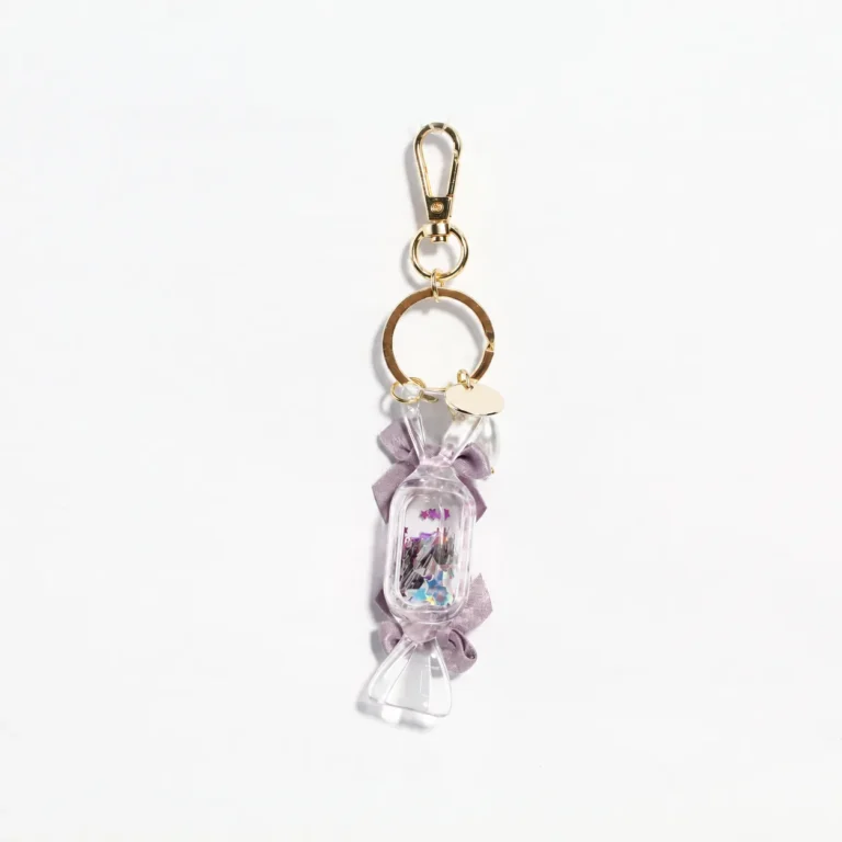 Lavender wrapped-candy-shaped keyring with bow accents