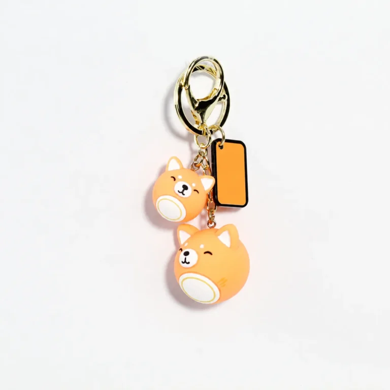 Orange cat figure keyring with matching round charm