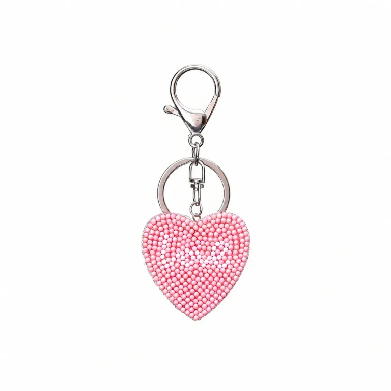 Beaded heart charm with clasp and round ring in pink, white, silver-tone, shown as a keychain.