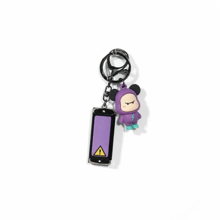 Purple hooded figure keyring with warning-style tag