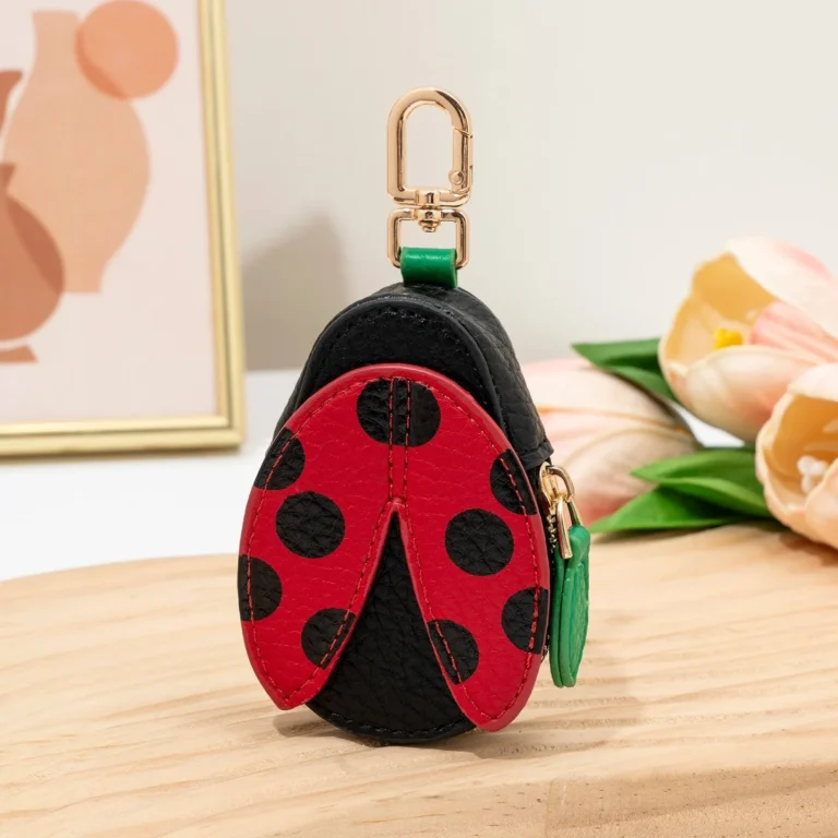 Red-and-black ladybug coin purse in tabletop display