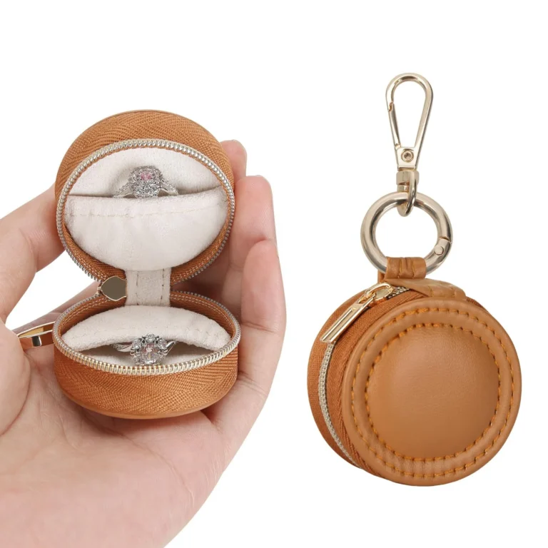 Tan round jewelry case in open and closed views