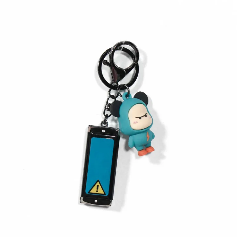 Teal hooded figure keyring with warning-style tag