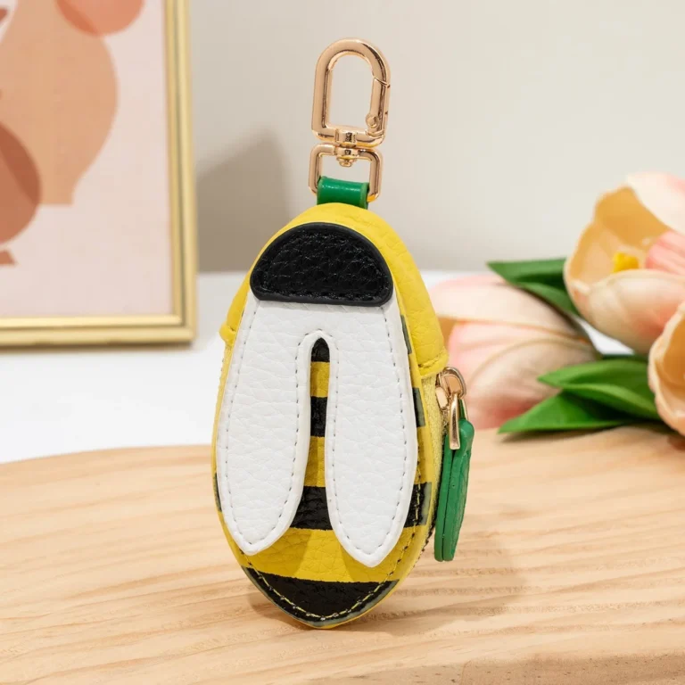 Yellow-and-black winged coin purse in tabletop display