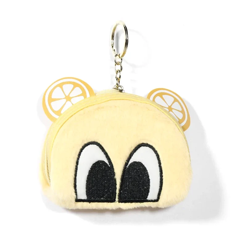 Yellow fuzzy coin purse with citrus-print ears